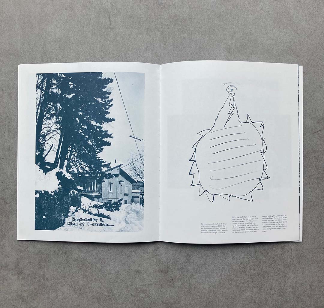 two pages with drawings on a gray table