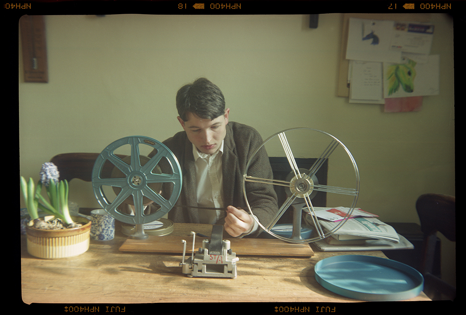 frame of a boy using a technical tool with two wheels on a table