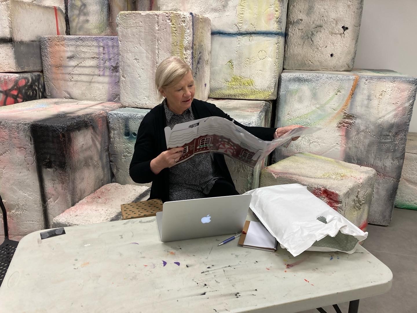 Woman sits reading something