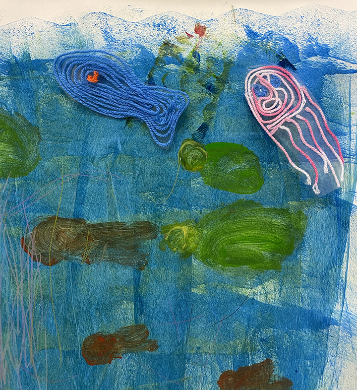 Fabric painted blue with blue, pink and green woollen fishes