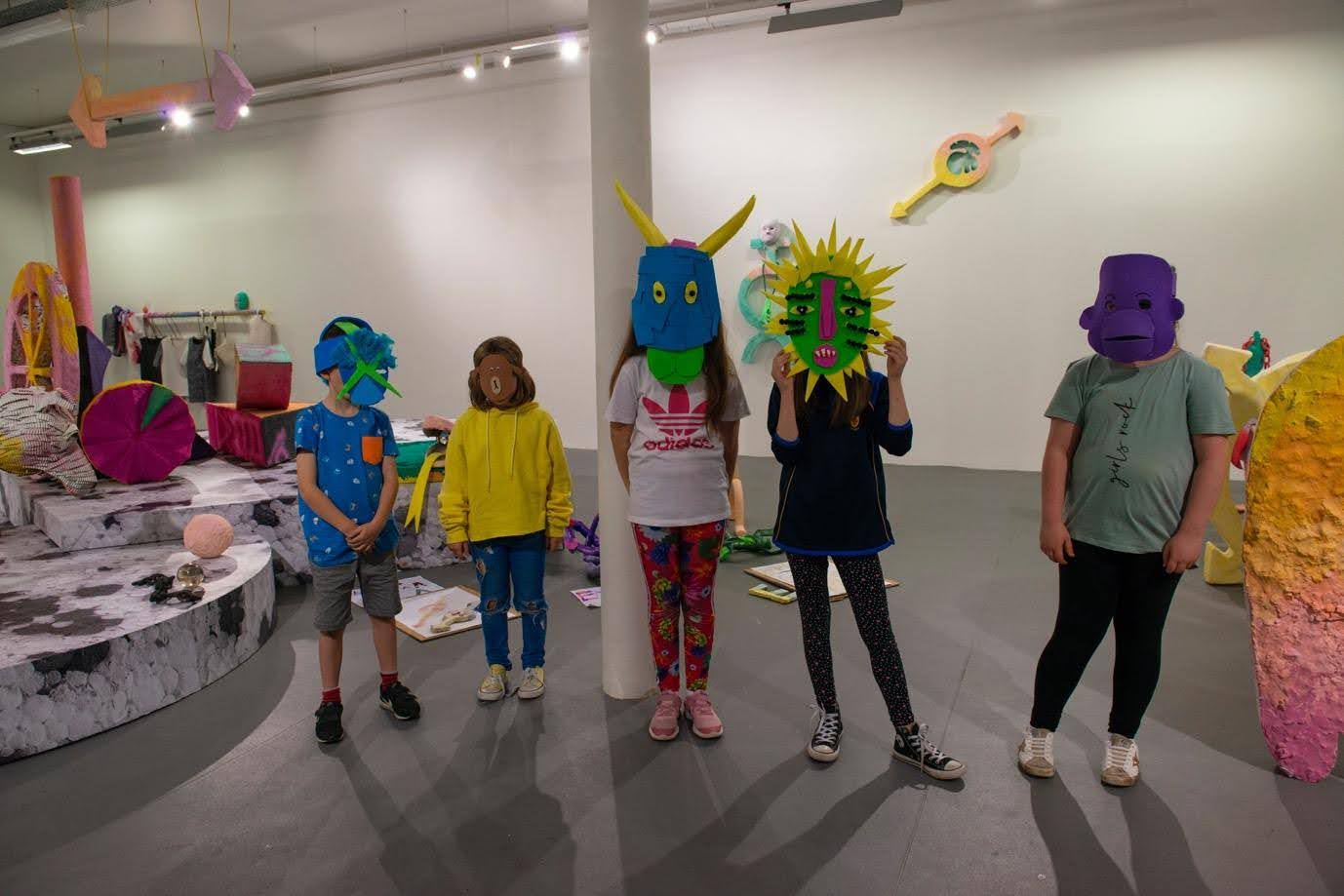 Children dressed in Masks at a Void Centre Workshop